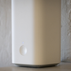 A photo of the Vilo mesh wifi node on a mantel